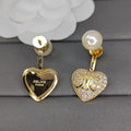 Celine Triomphe Diamond Heart Earrings - 18K Yellow Gold
